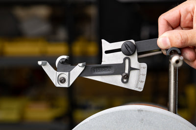 The Tormek KS-123 Knife Angle Setter being clipped onto the universal support bar of a Tormek T-8.